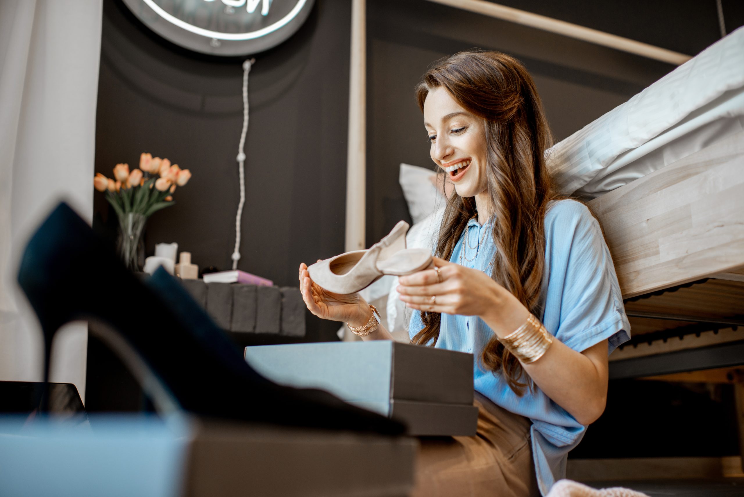 Woman enjoying her finds at home